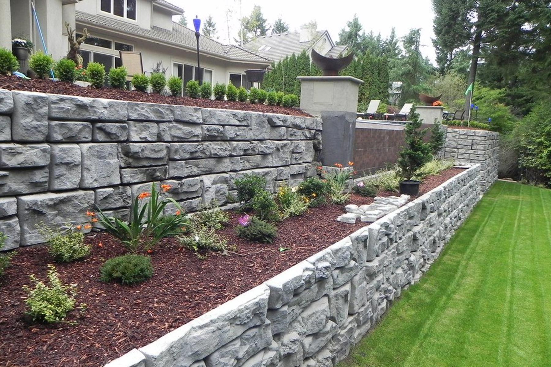 stone retaining wall in backyard