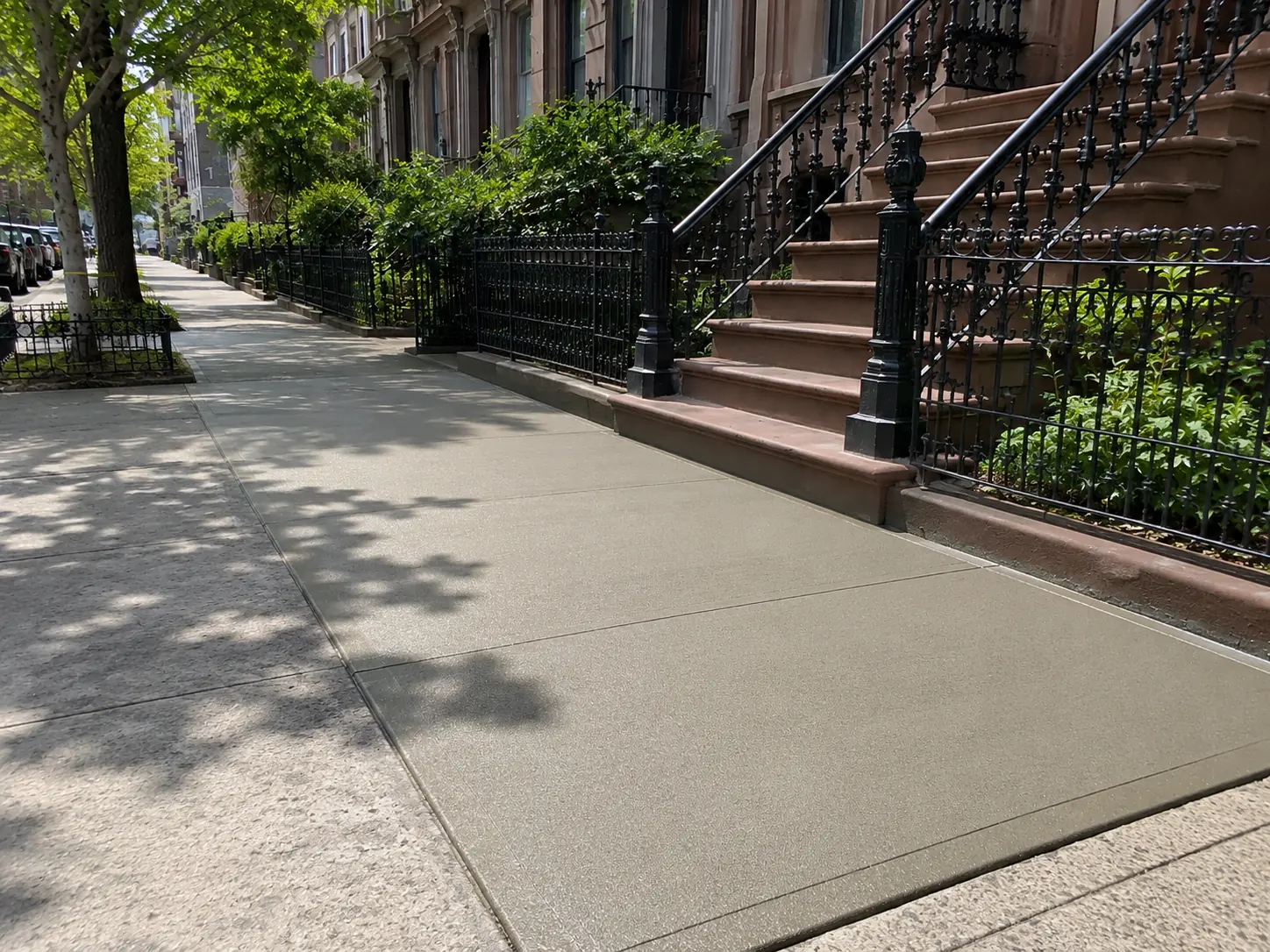 Concrete installation and repair around an NYC brownstone property